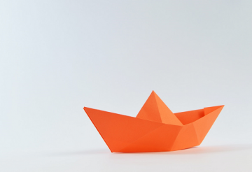 Orange boat made from paper - origami