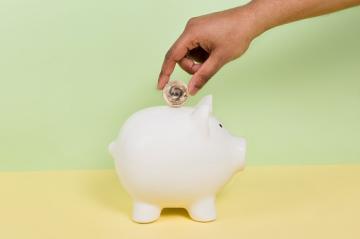 Coin into piggy bank pension scheme savings